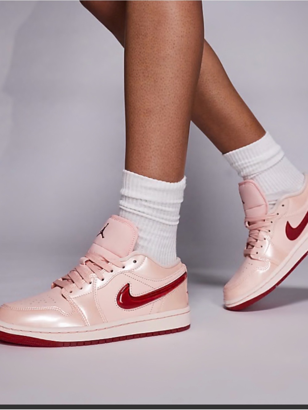 Nike Women's Pink Sneakers with Red Swoosh